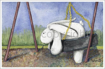 Mimi swinging on the playground